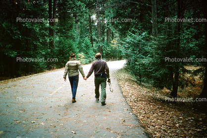 Couple going for a walk down the road