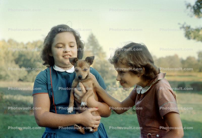 Two girls with a Puppy, 1950s