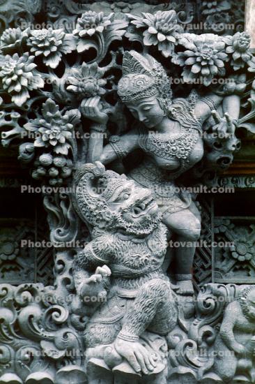 Dragon and a Lady, Stone Carving, flowers, Bali, Island of Bali