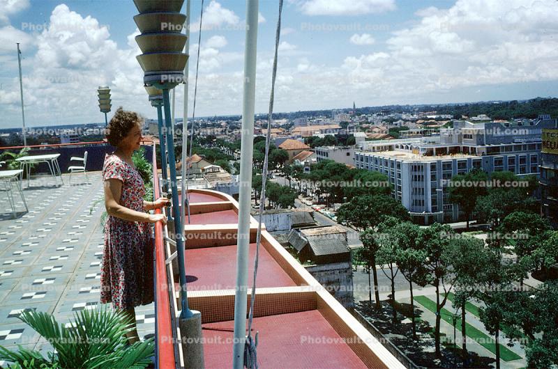 Woman overlooks the City, standing
