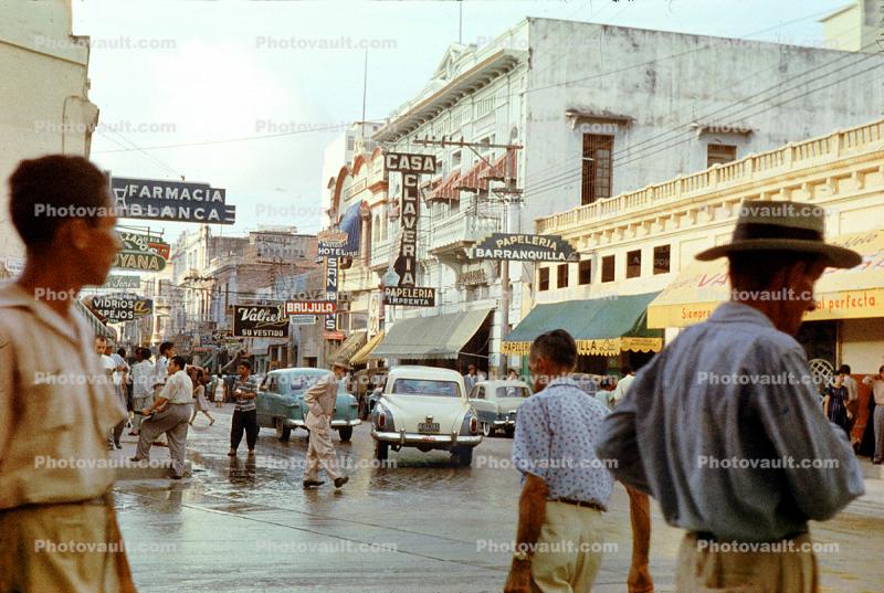 Casa Claveria, downtown, cars, buildings, city, shops, stores, hat, Studebaker, Cartagena, 1950s