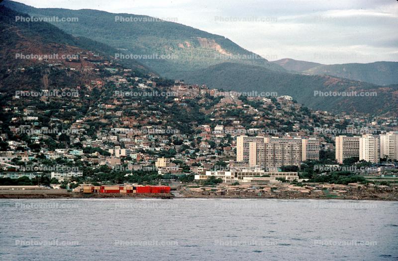 Docks, harbor, hillside, homes, buildings, mountains, waterfront, La Guaira, Maiquetia, Venezuela