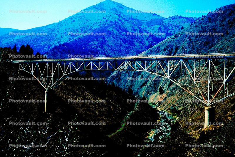 Upside down truss bridge, valley, hills, mountains