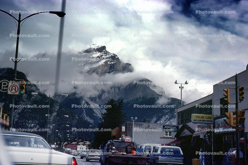 Banff Avenue, Cascade Mountain, clouds, cars, automobiles, vehicles, 1970s