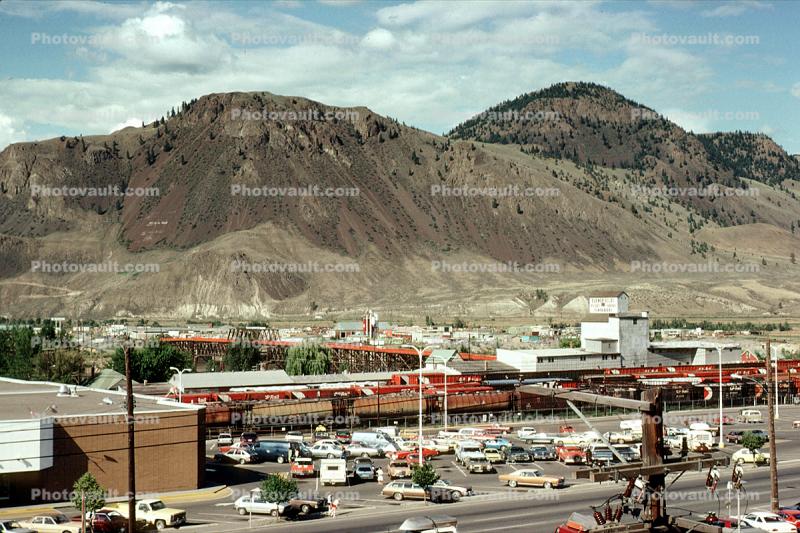 Cars, shopping center, automobiles, mall, buildings, mountains, desert, 1970s