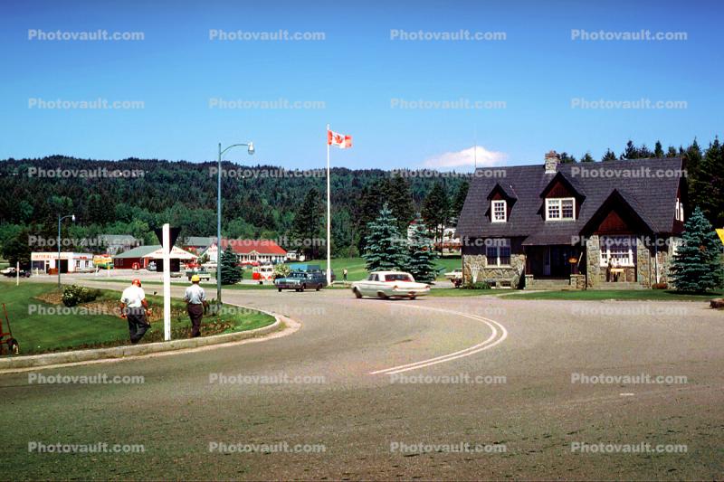 Bay of Fundy National Park Headquarters, building, cars, flag, Bay of Fundy, New Brunswick Canada, 1960s
