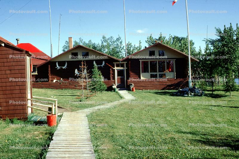 Log Cabins, footpath, buildings, God's Lake Lodge, Manitoba, Canada