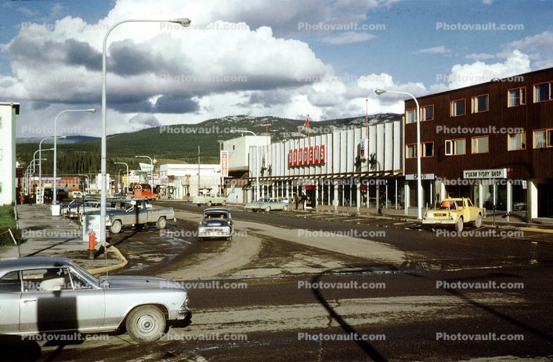 Hougens, Main Street, buildings, cars, automobile, vehicle, shops, stores, Whitehorse, 1960s
