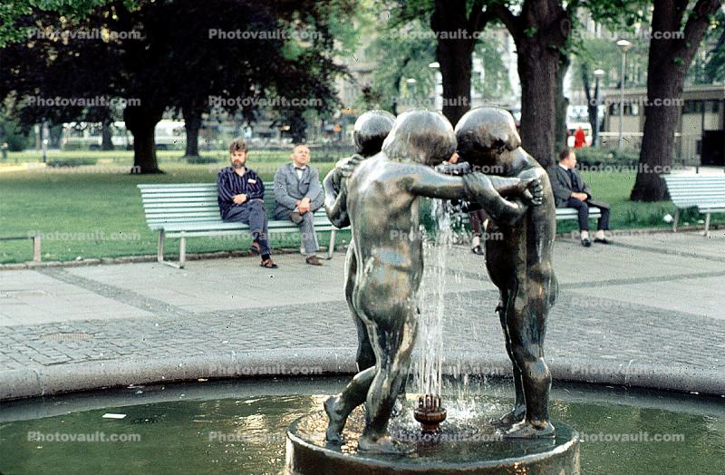Children in Embrace, Water Fountain, aquatics, bench, park