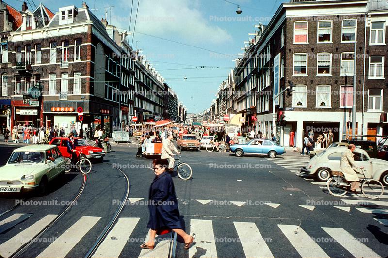 Cars, person, buildings, crosswalk, automobile, vehicles, 1960s, June 1977