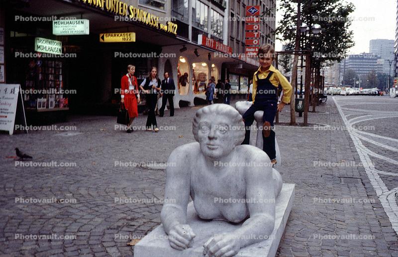 stores, cobblestone sidewalk, Berlin, October 1978, 1970s