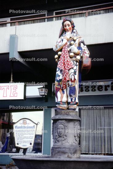 Ornate Female Statue, sculpture, column, colorful, clown, opulant