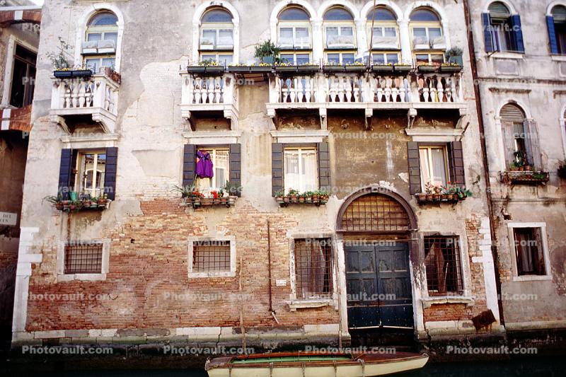 Boat Docked at Front Door, Residence Building, windows and Balconies