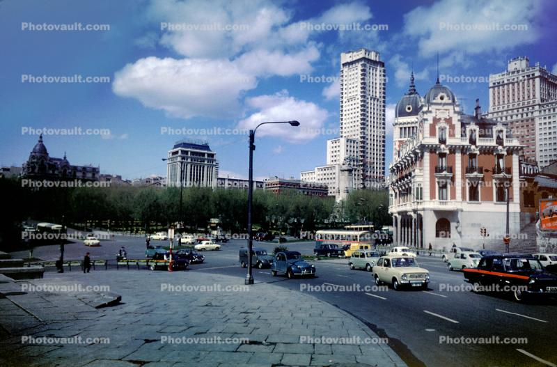 Cars, Roundabout, buildings, busy street, automobile, highrise, 1950s