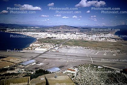 air strip, no mans land and spanish town of La Linea from observatiion point at north end of rock, April 1967, 1960s