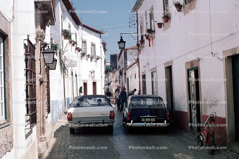 Cars, Stingray Bicycle, narrow cobblestone street, Spain, July 1974, 1970s