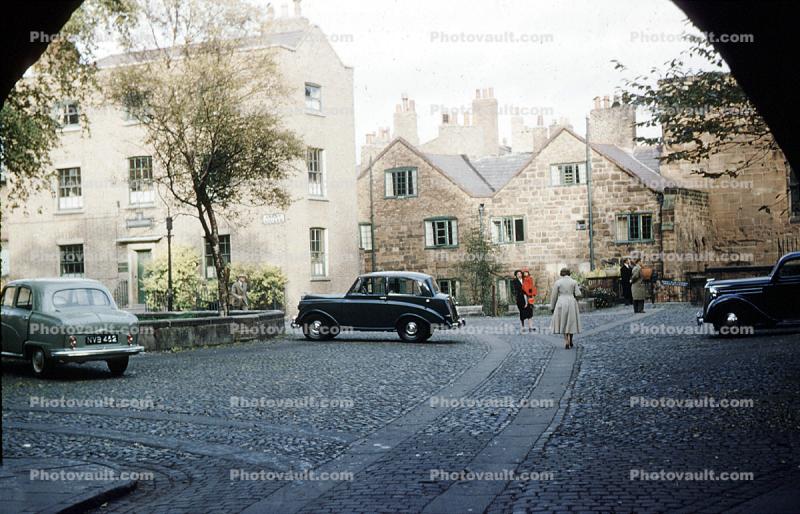 cobblestone street, cars, 1940s