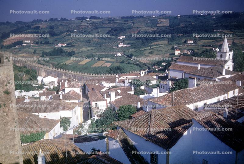 Rooftops, village, farm fields, church