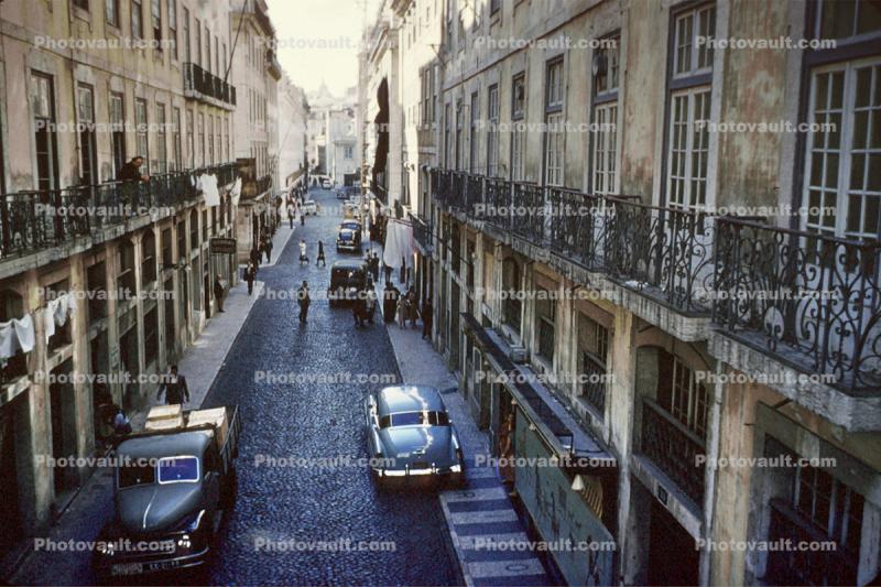 Coblestone Street, cars, buildings, balcony, automobile, vehicles, delivery truck, 1950s