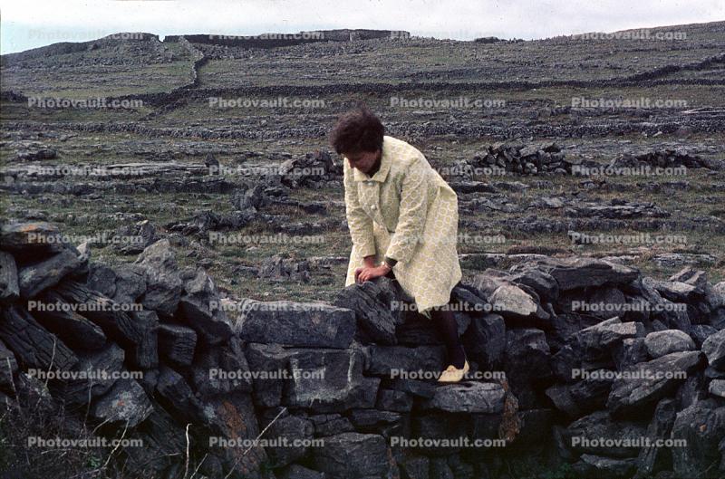 Ruins, rocks, fields, woman, Inishmore Aran Island, Galway Bay, Ireland