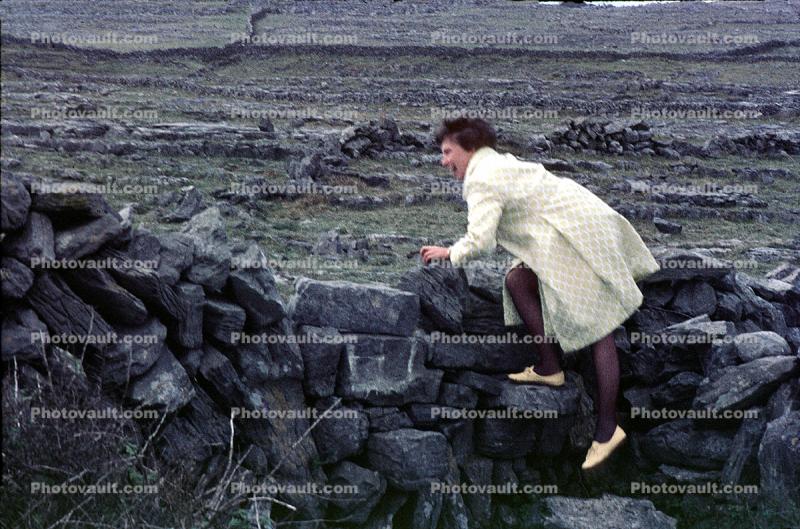 Ruins, rocks, fields, woman, Inishmore Aran Island, Galway Bay, Ireland