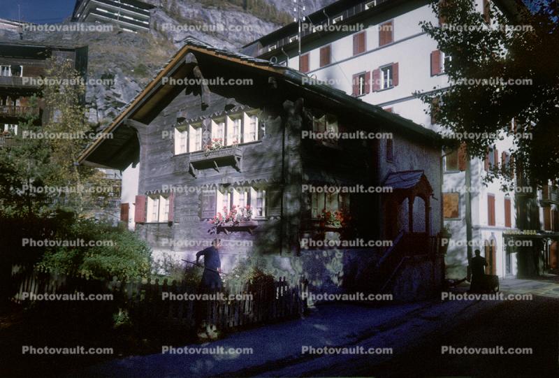 Woman working in her Garden, Home, House, Building, Zermatt, Switzerland, 1950s