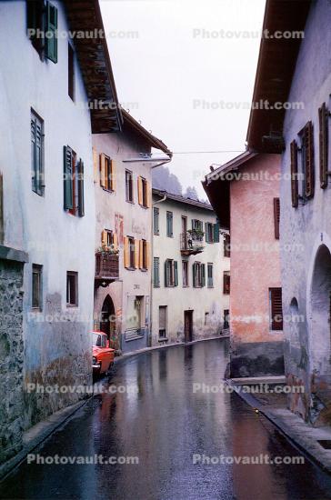 Wet narrow street, buildings, houses, Switzerland