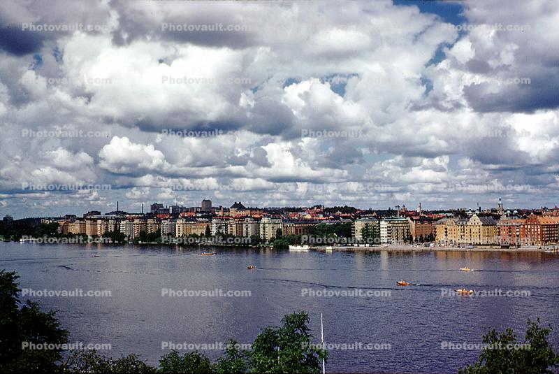 Apartments, buildings, boats, Cumulus Clouds, Stockholm, Baltic Sea