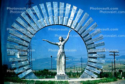 Female Steel Monument, sculpture, memorial, outstretched arms, woman, dress, Round, Circular, Circle