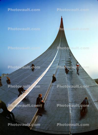 People Climbing the Space Obelisk, Sputnik Monument