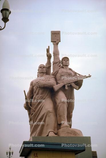 Communist Statue, revolutionary, man, woman, rifle, sculpture, 1950s