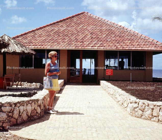 Woman, building, Tile Roof, stone wall, Curacao