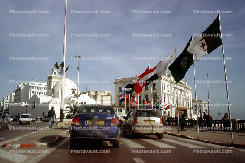 Building, cars, flags