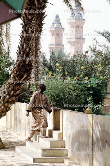 Man walking, steps, minaret