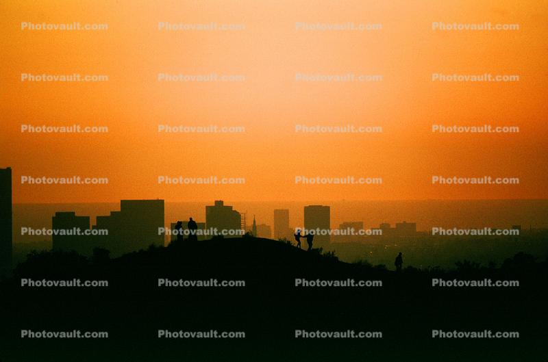 sunset, skyline, smog, haze, buildings, hill, people