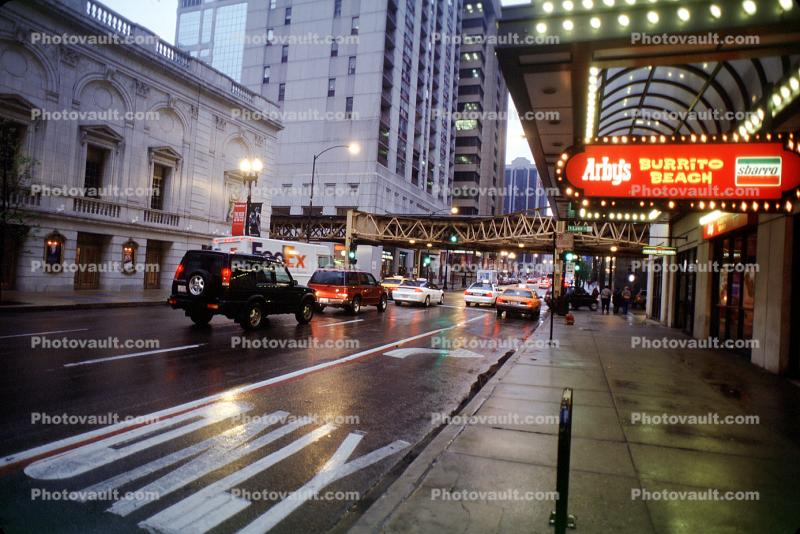 Chicago Theatre District, rain, inclement weather, slick, taxi, only arrow, sidewalk, buildings, awning, Cars, automobile, vehicles