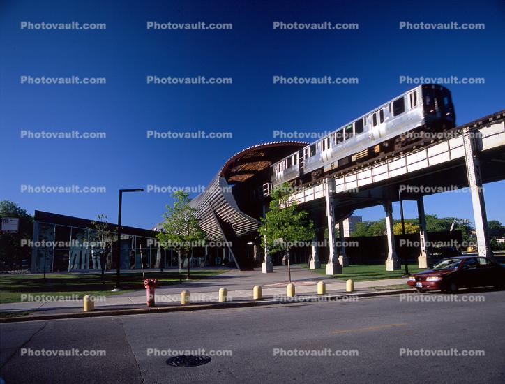 Chicago-El, Elevated, McCormick Tribune Center, architect Rem Koolhaas, stainless steel tube shielding, CTA Station, Train