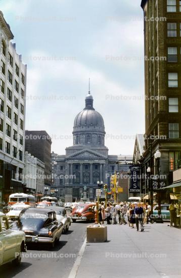 Downtown Indianapolis, cars, crowds, stores, Greyhound Bus Station, 1950s