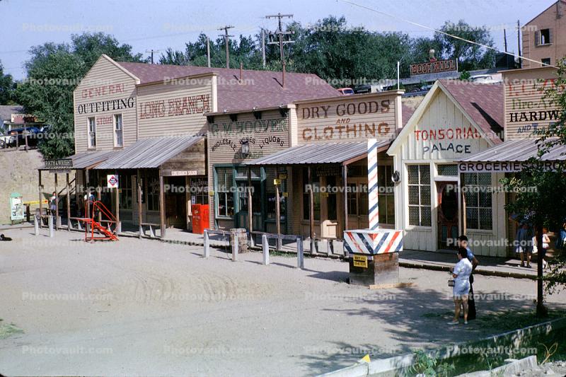 Buildings, shops, man, woman, purse, Dodge City, August 1963, 1960s