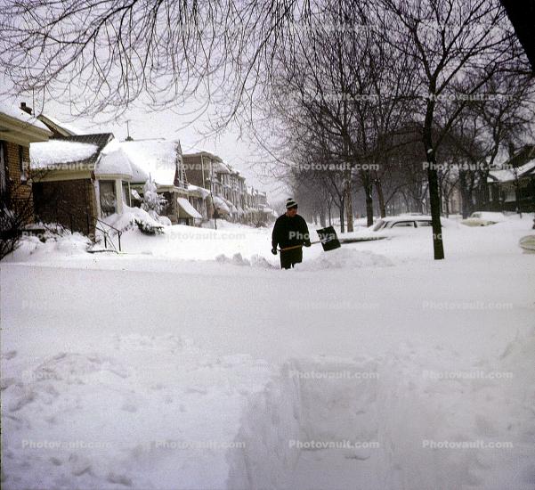 Sidewalk deep in snow, homes, houses, suburbs