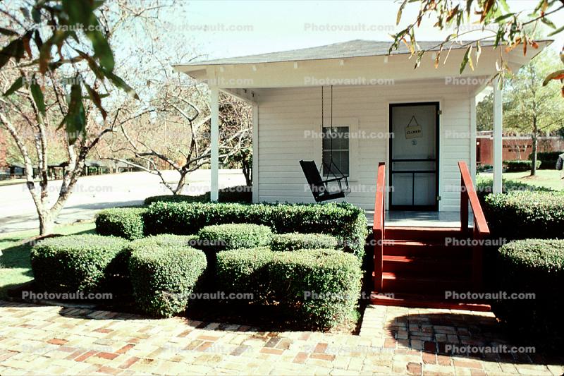 Elvis Presley Birthplace, porch, trimmed shrubs, manicured garden, Tupelo, famous landmark