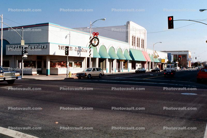 Topper, Buildings, stores, cars, street, awning, traffic light, Shops, Christmas decorations, intersection, road, Modesto, December 1988, 1980s