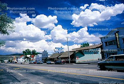 Clouds, cumulus, buildings, shops, Highway 395, cars