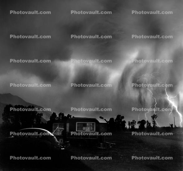 Lightning Storm over the Snake River Ranch, cars