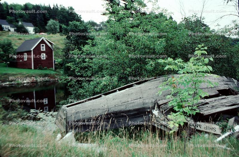 decaying boat, building, lake
