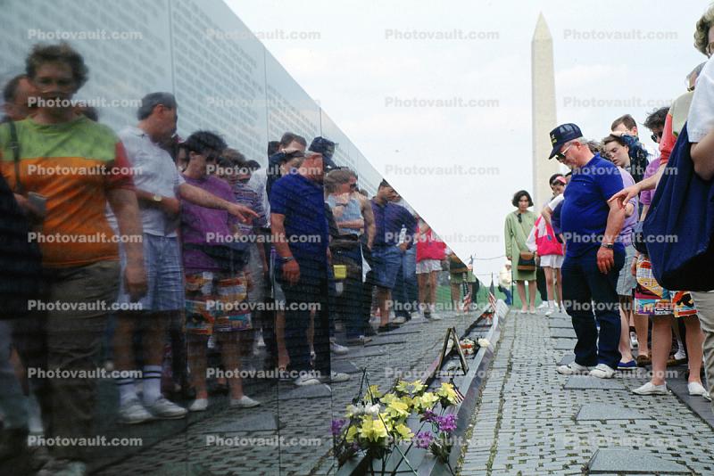 Vietnam Veterans Memorial, people, flowers, reflection