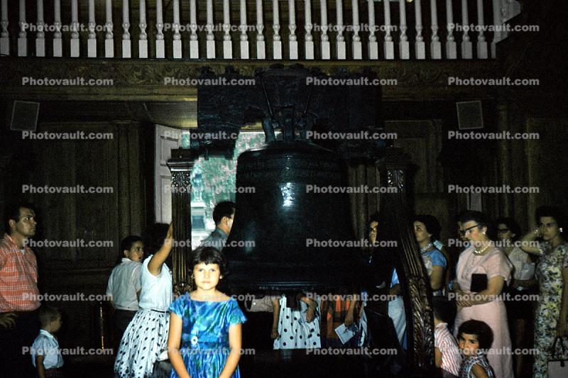Girl stands by the Liberty Bell, 1950s