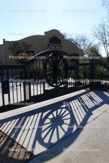 Paso Robles History Museum, wagon wheel, shadow