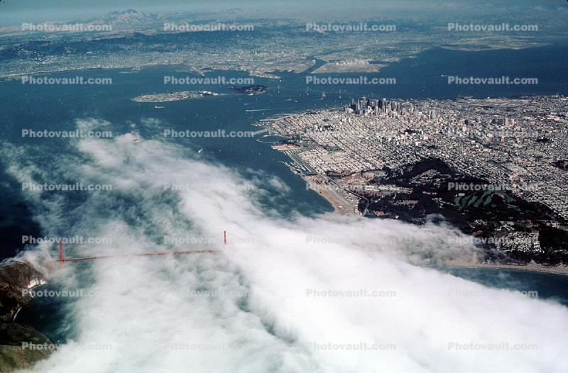 fingers of fog through the Golden Gate Bridge