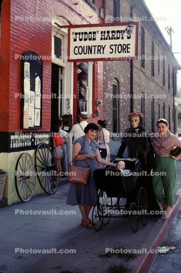 Judge Hardy's Country Store, Women with a Baby Carriage, wagon wheels, 1950s
